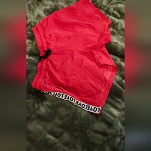 Red, lose fitting athletic shorts